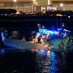 Emergency responders search the Potomac River near Reagan National Airport after a plane-helicopter collision.