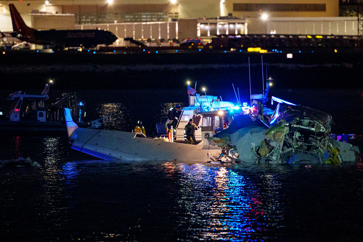 Emergency responders search the Potomac River near Reagan National Airport after a plane-helicopter collision.