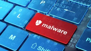 Hospital computer with malware alert symbol